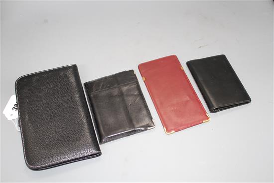 A Hermes leather filofax case, a Cartier leather passport holder, card holder and spectacle case